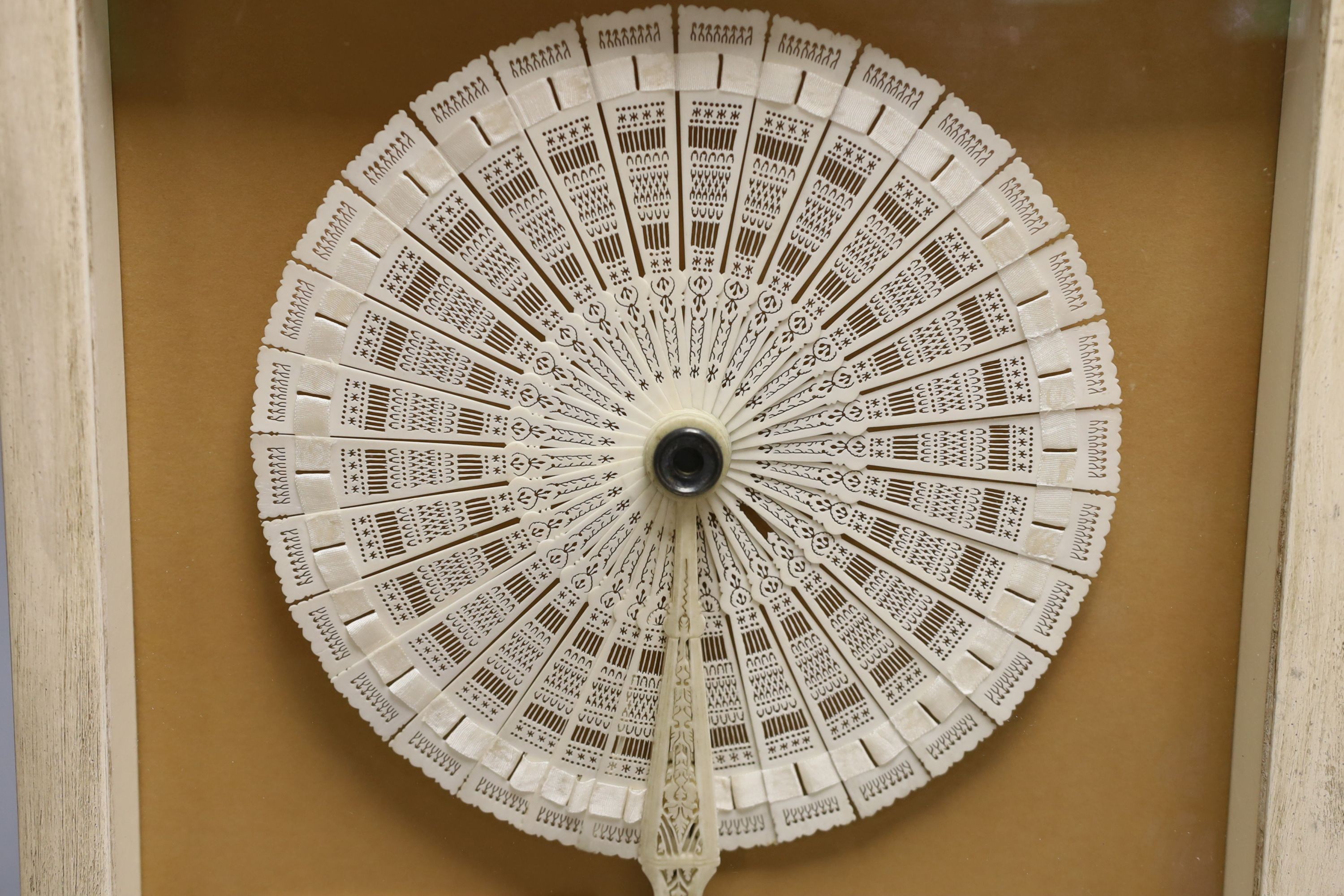 A 19th century ivory cased cockade brisé fan, bearing inscription to verso